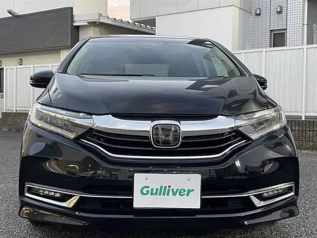 ホンダ シャトル ハイブリッド X ホンダセンシング 愛知県 2019(令1)年 3.1万km クリスタルブラックパール Gathersナビ（フルセグ、CD、DVD、AM、FM、BT）/バックカメラ/プッシュスタート/レーダークルーズコントロール/パドルシフト/ビルトインETC/ステアリングリモコン/ハーフレザーシート/シートヒーター（DN）/オートライト/電格ウィンカーミラー/横滑り防止/衝突軽減システム/路外逸脱抑制システム/スペアキー/取扱説明書/ナビ取扱説明書/保証書