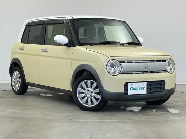 スズキ ラパン X 新潟県 2015(平27)年 2.6万km シフォンアイボリーメタリック 禁煙車/登録時走行距離：25786km/メーカーオプション純正ナビ/CD/フルセグTV/Bluetooth/AUX/全方位カメラ/バックカメラ/前後ドライブレコーダー/ETC/衝突被害軽減システム/横滑り防止装置/HIDヘッドライト/運転席シートヒーター/エンジンスタートボタン/スマートキー/純正フロアマット/純正14インチアルミホイール