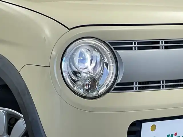 スズキ ラパン X 新潟県 2015(平27)年 2.6万km シフォンアイボリーメタリック 禁煙車/登録時走行距離：25786km/メーカーオプション純正ナビ/CD/フルセグTV/Bluetooth/AUX/全方位カメラ/バックカメラ/前後ドライブレコーダー/ETC/衝突被害軽減システム/横滑り防止装置/HIDヘッドライト/運転席シートヒーター/エンジンスタートボタン/スマートキー/純正フロアマット/純正14インチアルミホイール