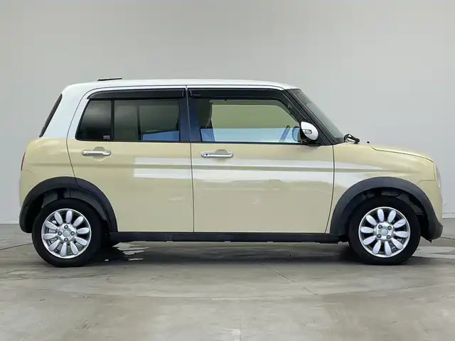 スズキ ラパン X 新潟県 2015(平27)年 2.6万km シフォンアイボリーメタリック 禁煙車/登録時走行距離：25786km/メーカーオプション純正ナビ/CD/フルセグTV/Bluetooth/AUX/全方位カメラ/バックカメラ/前後ドライブレコーダー/ETC/衝突被害軽減システム/横滑り防止装置/HIDヘッドライト/運転席シートヒーター/エンジンスタートボタン/スマートキー/純正フロアマット/純正14インチアルミホイール