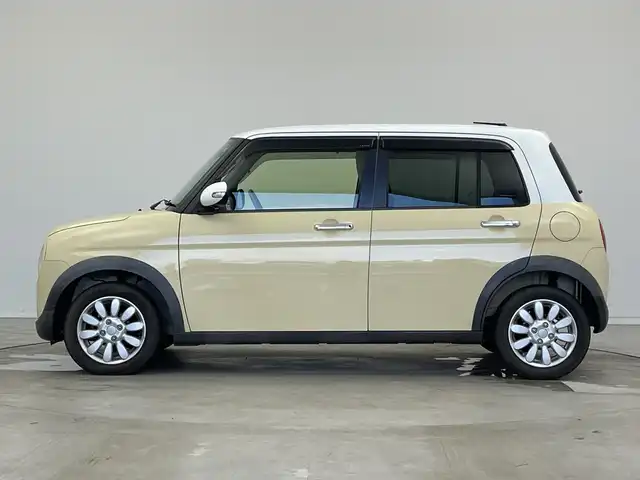 スズキ ラパン X 新潟県 2015(平27)年 2.6万km シフォンアイボリーメタリック 禁煙車/登録時走行距離：25786km/メーカーオプション純正ナビ/CD/フルセグTV/Bluetooth/AUX/全方位カメラ/バックカメラ/前後ドライブレコーダー/ETC/衝突被害軽減システム/横滑り防止装置/HIDヘッドライト/運転席シートヒーター/エンジンスタートボタン/スマートキー/純正フロアマット/純正14インチアルミホイール