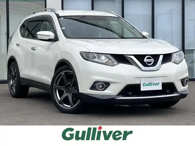 日産 エクストレイル 20X エマージェンシーブレーキ 道南・函館 2015(平27)年 5.5万km ブリリアントホワイトパール ・7人乗り/・社外ＳＤナビ（ＣＤ、ＤＶＤ、ＢＴ）/・フルセグＴＶ/・フリップダウンモニター/・バックカメラ/・衝突軽減ブレーキ/・ブラインドスポットモニター/・前後コーナーセンサー/・電動リアゲート/・前席シートヒーター/・社外ＡＷ/・ルーフレール/・NISMOスポーツサスペンション/・ETC
