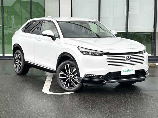 ホンダ ヴェゼル ハイブリッド e:HEV Z 岐阜県 2025(令7)年 0.1千km プラチナホワイトパール 登録時走行距離3km/純正９型ナビ/バックカメラ/パドルシフト/Ｈｏｎｄａ　ＳＥＮＳＩＮＧ/ブラインドスポットインフォメーション/ステアリングヒーター/クルーズコントロール/ワンオーナー/電動リアゲート/Bluetooth/AppleCarPlay/AndroidAuto/USB入力端子/ハーフレザーシート/スマートキー/プッシュスタート/スペアキー/LEDヘッドライト/オートライト/純正アルミホイール/レーンキープアシスト/衝突被害軽減システム/ETC2/0