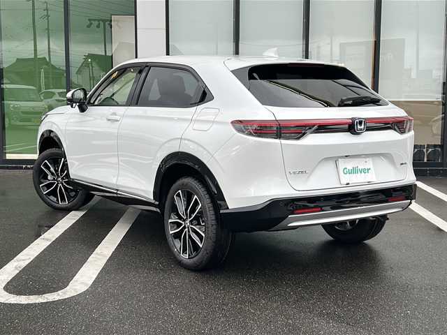 ホンダ ヴェゼル ハイブリッド e:HEV Z 岐阜県 2025(令7)年 0.1千km プラチナホワイトパール 登録時走行距離3km/純正９型ナビ/バックカメラ/パドルシフト/Ｈｏｎｄａ　ＳＥＮＳＩＮＧ/ブラインドスポットインフォメーション/ステアリングヒーター/クルーズコントロール/ワンオーナー/電動リアゲート/Bluetooth/AppleCarPlay/AndroidAuto/USB入力端子/ハーフレザーシート/スマートキー/プッシュスタート/スペアキー/LEDヘッドライト/オートライト/純正アルミホイール/レーンキープアシスト/衝突被害軽減システム/ETC2/0