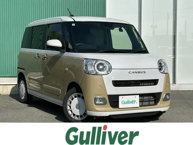 ダイハツ ムーヴ キャンバス ストライプス G 福岡県 2022(令4)年 1.4万km シャイニングホワイトパール/サンドベージュメタリック Panasonicナビ/（BT/フルセグ/DISC/AM/FM/SD/SDREC）/Bカメラ/両側パワースライドドア/LEDヘッドライト/オートライト/前席シートヒーター/ベンチシート/ホッとカップホルダー/アイドリングストップ/横滑り防止装置/コーナーセンサー/盗難防止装置/衝突被害軽減システム/ドライブレコーダー/ブレーキホールド/スマートキー/保証書/取扱説明書