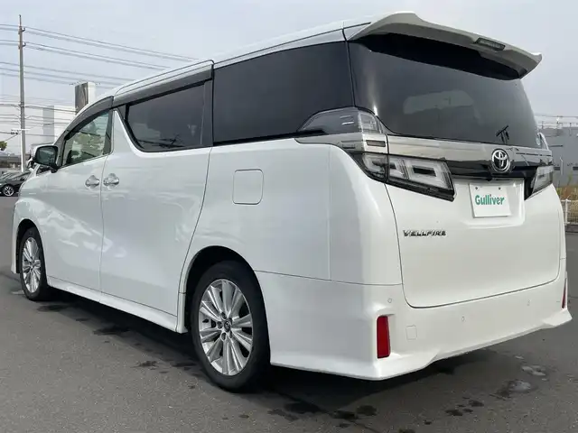 トヨタ ヴェルファイア Z Aエディション 岡山県 2018(平30)年 12.2万km ホワイトパールクリスタルシャイン 登録時走行距離121146km/純正9インチナビ/フルセグTV(AM/FM/CD/DVD/Bluetooth)/純正12.1インチフリップダウンモニター/バックカメラ/両側パワースライドドア/ビルトインETC　/デジタルインナーミラー/トヨタセーフティセンス/・プリクラッシュセーフティ/・レーダークルーズコントロール/・オートマチックハイビーム/・レーンディバーチャーアラート/オートブレーキホールド/横滑り防止装置/シートカバー/オットマン/18インチ純正AW/純正フロアマット