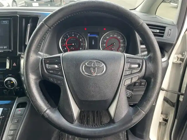 トヨタ ヴェルファイア Z Aエディション 岡山県 2018(平30)年 12.2万km ホワイトパールクリスタルシャイン 登録時走行距離121146km/純正9インチナビ/フルセグTV(AM/FM/CD/DVD/Bluetooth)/純正12.1インチフリップダウンモニター/バックカメラ/両側パワースライドドア/ビルトインETC　/デジタルインナーミラー/トヨタセーフティセンス/・プリクラッシュセーフティ/・レーダークルーズコントロール/・オートマチックハイビーム/・レーンディバーチャーアラート/オートブレーキホールド/横滑り防止装置/シートカバー/オットマン/18インチ純正AW/純正フロアマット
