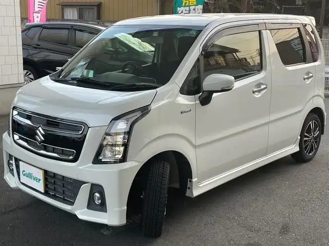 スズキ ワゴンＲ スティングレー HYBRID T 埼玉県 2017(平29)年 5.4万km ピュアホワイトP ワンオーナー/純正オプションKENWOODメモリナビ/　DTV/CD/DVD/SD/BT/USB/【SKX-S801A】/デュアルセンサーブレーキサポート/クルーズコントロール/誤発進抑制機能/車線逸脱警報機能/ふらつき警報機能/先行車発進お知らせ機能/ハイビームアシスト機能/ヘッドアップディスプレイ/前席シートヒーター/パドルシフト/LEDヘッドライト/LEDフォグランプ/オートライト/社外14インチAW/スマートキー/ETC/純正165/55-15インチAW/　サマータイヤ付き4mm山車載