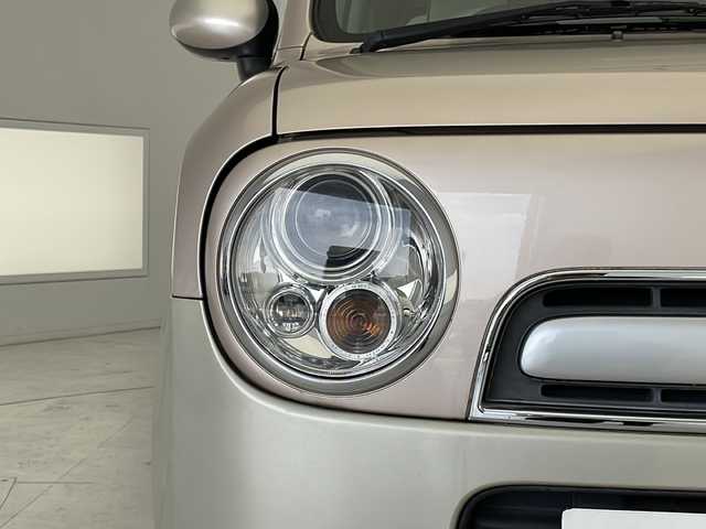スズキ ラパン ショコラ G 愛知県 2013(平25)年 4.1万km シャンパンピンクPM SDナビ　/ワンセグ　/CD　/Bluetooth　/HIDヘッドライト　/オートライト　/アイドリングストップ　/純正フロアマット　/スマートキー　/プッシュスタート