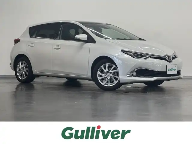 トヨタ オーリス 180G 三重県 2015(平27)年 5.6万km ホワイトパールクリスタルシャイン 1.8L ガソリン/FF/MTモード付フロアCVT（7速スポーツシーケンシャルシフトマチック）/純正 9インチナビ NSZT-Y64T/（AM/FM/CD/DVD/SD/SDREC/Bluetooth/TV）/バックガイドモニター/ドライブレコーダー 前方/ビルトイン ETC/Toyota Safety Sense/●プリクラッシュセーフティ［PCS］/●レーンディパーチャーアラート［LDA］/●オートマチックハイビーム［AHB］/●VSC&TRC（横滑り防止制御）/・【OP】SRS エアバッグ（運転席・助手席・サイド・カーテンシールド）/・ABS/など/装備/●ハーフレザーシート/●左右独立温度独立調整オートエアコン/●オートライト/●フロントフォグランプ/●ヘッドライトオートレベリング機能/●ステアリングスイッチ/●パドルシフト/●LEDクリアランスランプ/●プッシュスタート/●スマートキーx2/●純正 16inAW/など