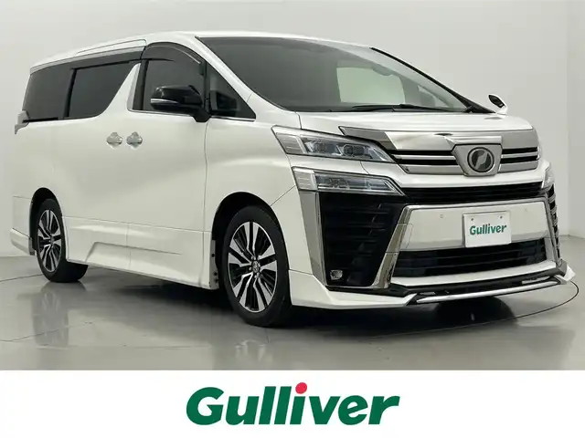 トヨタ ヴェルファイア Z Gエディション 熊本県 2019(令1)年 4.1万km ホワイトパールクリスタルシャイン 社外１１インチナビ（CD/DVD/Bluetooth/フルセグTV）/社外フリップダウンモニター/バックカメラ/ビルトインETC/レザーシート/前席シートヒーター＆ベンチレーション/前席パワーシート/電動テレスコ＆チルトステアリング/ステアリングヒーター/アドミレイションエアロ/電動パーキングブレーキ・ブレーキホールド/AC100V//トヨタセーフティセンス/・プリクラッシュセーフティ/・レーンディパーチャーアラート/・ロードサインアシスト/・レーダークルーズコントロール/・アダプティブハイビーム/・パーキングサポートブレーキ/純正アルミホイール