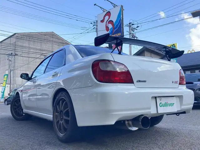 スバル インプレッサ ＷＲＸ S202 STiバージョン 長崎県 2002(平14)年 12.2万km ピュアホワイト 登録時122009km/400台限定車/S202　046/400/社外ナビ/Bluetoothaudio/TV/DVD/6MT/ターボタイマー/STI17インチアルミホイール/HKS車高調/HKSマフラー/bremboキャリパー/タワーバー