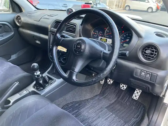 スバル インプレッサ ＷＲＸ S202 STiバージョン 長崎県 2002(平14)年 12.2万km ピュアホワイト 登録時122009km/400台限定車/S202　046/400/社外ナビ/Bluetoothaudio/TV/DVD/6MT/ターボタイマー/STI17インチアルミホイール/HKS車高調/HKSマフラー/bremboキャリパー/タワーバー
