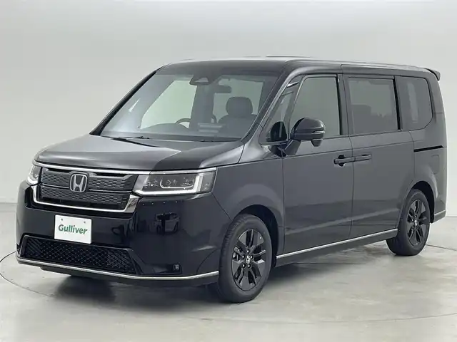 ホンダ ステップワゴン スパーダ eHEV 福岡県 2025(令7)年 0.1万km未満 クリスタルブラックパール 登録済未使用車　/純正１１．４ナビ　/Ｂカメラ　/ＡＣＣ　/コーナーセンサー　/衝突軽減　/レーンキープ　/ＢＳＭ　/アクセル踏み間違い防止　/パドルシフト　/両側電動スライドドア　/ハーフレザー　/シートヒーター　/ＬＥＤ