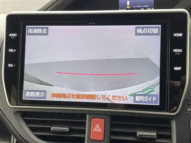 トヨタ エスクァイア ハイブリッド Gi プレミアムパッケージ ブラックテーラード 熊本県 2019(平31)年 6.9万km ホワイトパールクリスタルシャイン 純正１０インチナビ（ＮＳＺＮ－Ｚ６８Ｔ）/フルセグTV/CD/DVD/SD/BT/HDMI/純正フリップダウンモニター/両側パワースライドドア/ETC/純正エアロ/前席シートヒーター/ステアリングヒーター/前後クリアランスソナー/ロールサンシェード/トヨタセーフティーセンス/・プリクラッシュセーフティ/・レーンキープアシスト/・オートハイビーム/・クルーズコントロール/横滑り防止/ハーフレザーシート/純正フロアマット/純正１５インチAW/オートライト/LEDヘッドライト/スマートキー/プッシュスタート/スペアキー1本