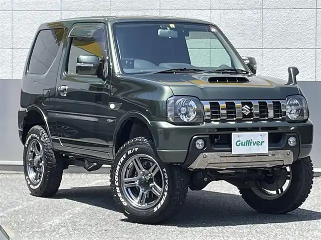スズキ ジムニー ランドベンチャー 東京都 2018(平30)年 2.1万km クールカーキPM ４WD/純正メモリ-ナビ(CN-E204Z)/CD/FM・AM/AUX/SD//ワンセグTV/バックカメラ/社外フロントカメラ/ETC/ドライブレコーダー前後/レザーシート/シートヒーター/３インチリフトアップ（タニグチ）/社外ヒッチメンバー(SOREX）/LEDヘッドライト/ヘッドライトレベライザー/ドアバイザー/純正フロアマット/スペアキー/純正１６インチAW/オープンカントリーR/Tオフロードタイヤ/保証書/取扱説明書
