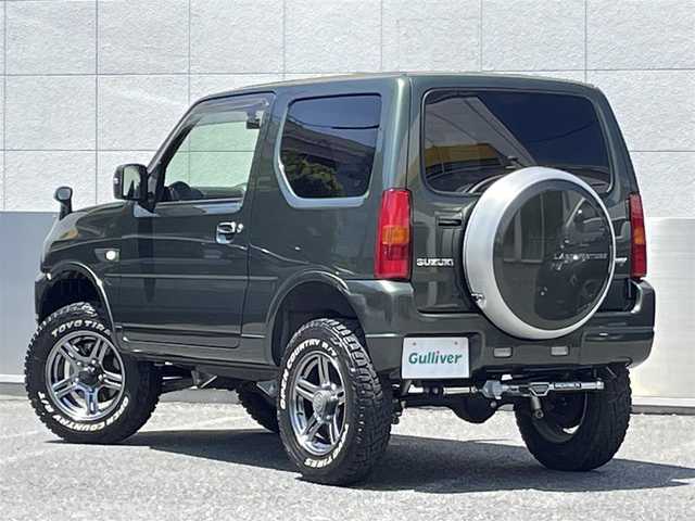 スズキ ジムニー ランドベンチャー 東京都 2018(平30)年 2.1万km クールカーキPM ４WD/純正メモリ-ナビ(CN-E204Z)/CD/FM・AM/AUX/SD//ワンセグTV/バックカメラ/社外フロントカメラ/ETC/ドライブレコーダー前後/レザーシート/シートヒーター/３インチリフトアップ（タニグチ）/社外ヒッチメンバー(SOREX）/LEDヘッドライト/ヘッドライトレベライザー/ドアバイザー/純正フロアマット/スペアキー/純正１６インチAW/オープンカントリーR/Tオフロードタイヤ/保証書/取扱説明書