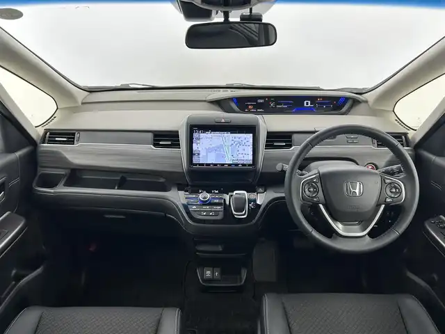 ホンダ フリード ハイブリット G ホンダセンシング 愛知県 2021(令3)年 4.6万km プラチナホワイトパール ホンダセンシング/・衝突軽減ブレーキ/・アクティブクルーズコントロール/・レーンキープアシスト/・ロードサインアシスト/・先行車発進お知らせ機能/純正ナビ/・フルセグTV/・CD/DVD/Bluetooth/ラジオ/主要装備/・両側パワースライドドア/・バックカメラ/・ETC/・ドライブレコーダー/・シートヒーター/・ハーフレザーシート/・ステアリングリモコン/・オートライト/・プッシュスタート