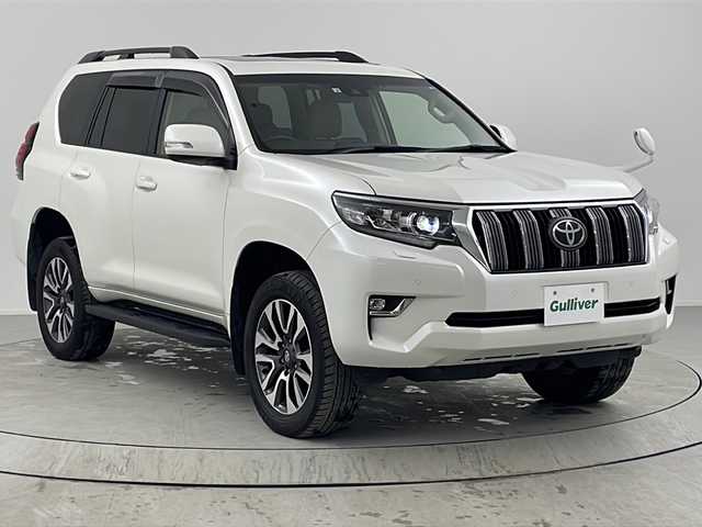 トヨタ ランドクルーザー プラド TX Lパッケージ 熊本県 2022(令4)年 3.2万km ホワイトパールクリスタルシャイン 禁煙車/パートタイム4WD/トヨタセーフティセンス/社外ナビTV/（ストラーダ/CN-HE01WD/CD/DVD/Bluetooth/フルセグTV)/純正LEDオートライト/純正LEDフォグ/純正19インチアルミ/純正フロアマット/ベージュ本革シート/サンルーフ/プリクラッシュセーフティ/アダプティブクルーズコントロール/レーンディパーチャーアラート/オートマチックハイビーム/クリアランスソナー/前席パワーシート/エアシート/デュアルオートエアコン/電動格納シート/本革巻ハンドル/ルーフレール/ETC/スマートキー/プッシュエンジンスタート/スペアキー/新車時保証書/取扱い説明書