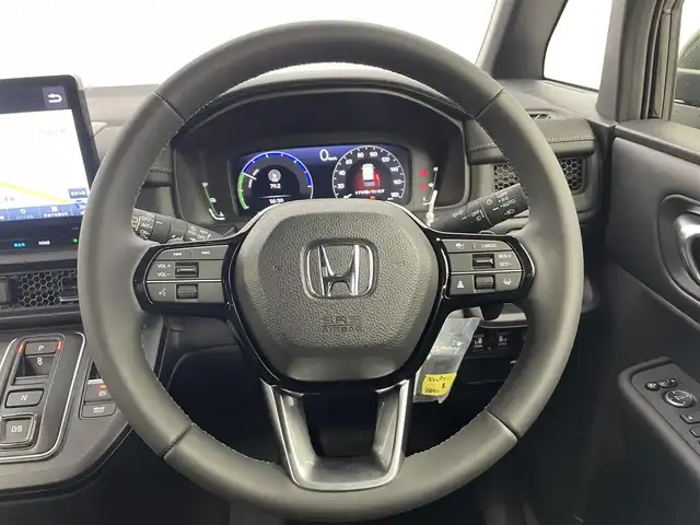 ホンダ ステップワゴン スパーダ eHEV 富山県 2025(令7)年 0.1千km クリスタルブラックパール 純正11.4型ナビ（AM/FM/DVD/BT/USB/フルセグ）/バックカメラ/純正15.6型後席モニター/両側パワースライドドア/パワーバックドア/ハーフレザーシート/D/N席シートヒーター/ブラインドスポットモニター/衝突被害軽減システム/レーダークルーズコントロール/レーンキープアシスト/コーナーセンサー/アイドリングストップ/純正アルミホイール/オートLEDライト/フォグライト/革巻きステアリング/ステアリングスイッチ/パドルシフト/スマートキー/スペアキー