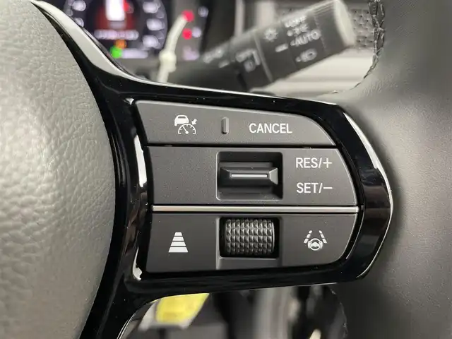 ホンダ ステップワゴン スパーダ eHEV 富山県 2025(令7)年 0.1千km クリスタルブラックパール 純正11.4型ナビ（AM/FM/DVD/BT/USB/フルセグ）/バックカメラ/純正15.6型後席モニター/両側パワースライドドア/パワーバックドア/ハーフレザーシート/D/N席シートヒーター/ブラインドスポットモニター/衝突被害軽減システム/レーダークルーズコントロール/レーンキープアシスト/コーナーセンサー/アイドリングストップ/純正アルミホイール/オートLEDライト/フォグライト/革巻きステアリング/ステアリングスイッチ/パドルシフト/スマートキー/スペアキー