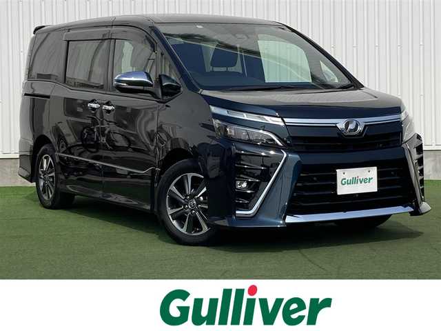 トヨタ ヴォクシー ZS 煌Ⅱ 香川県 2020(令2)年 5.7万km ブラッキッシュアゲハガラスフレーク 登録時走行距離：56377km/純正10型SDナビゲーション/→CD/DVD 再生/→フルセグTV/バックカメラ/両側パワースライドドア/衝突被害軽減システム/クルーズコントロール/レーンキープアシスト/オートハイビーム/LEDオートライト/フォグランプ/ビルトインETC/電格ウィンカーミラー/横滑り防止装置/アイドリングストップ/後席サンシェード/スマートキー