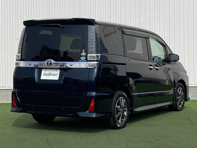 トヨタ ヴォクシー ZS 煌Ⅱ 香川県 2020(令2)年 5.7万km ブラッキッシュアゲハガラスフレーク 登録時走行距離：56377km/純正10型SDナビゲーション/→CD/DVD 再生/→フルセグTV/バックカメラ/両側パワースライドドア/衝突被害軽減システム/クルーズコントロール/レーンキープアシスト/オートハイビーム/LEDオートライト/フォグランプ/ビルトインETC/電格ウィンカーミラー/横滑り防止装置/アイドリングストップ/後席サンシェード/スマートキー