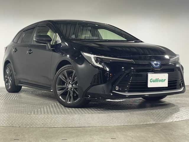 トヨタ カローラツーリング ハイブリッド ダブルバイビー 神奈川県 2023(令5)年 4.1万km アティチュードブラックマイカ トヨタセーフティセンス/・プリクラッシュセーフティ/・レーントレーシングアシスト+レーンディパーチャーアラート/・レーダークルーズコントロール（全車速追従機能付き）/・オートマチックハイビーム/・ロードサインアシスト/・ドライバー異常時対応システム/・プロアクティブドライビングアシスト/・発進遅れ告知機能/純正ディスプレイオーディオ/・BT/フルセグTV/MiraCast/USB/AM/FM/バックカメラ/ハーフレザーシート/シートヒーター(D/N)/ビルトインETC2.0/AC100V/電動サイドブレーキ/オートホールド/革巻きステアリング/ステアリングスイッチ/ステアリングヒーター/Autoライト/ヘッドライトレベライザー/シートリフター/スマートキー/プッシュスタートボタン/LEDヘッドライト/フォグランプ/コーナーセンサー/電動格納ミラー/ウィンカーミラー/純正フロアマット/純正アルミホイール/純正ドアバイザー