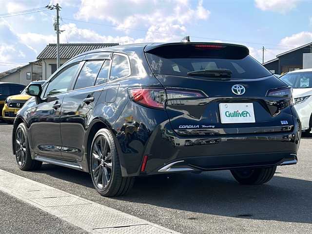 トヨタ カローラツーリング ハイブリッド ダブルバイビー 香川県 2023(令5)年 4.1万km アティチュードブラックマイカ 純正ナビ（フルセグTV/BT)/バックカメラ/ステアリングヒーター/ブラインドスポットモニター/ヘッドライトレベライザー/後退時交差車両検知警報システム/安心降車アシスト/ロードサインアシスト/シートヒーター/コーナーセンサー/オートライト/アイドリングストップ/ビルトインETC2.0