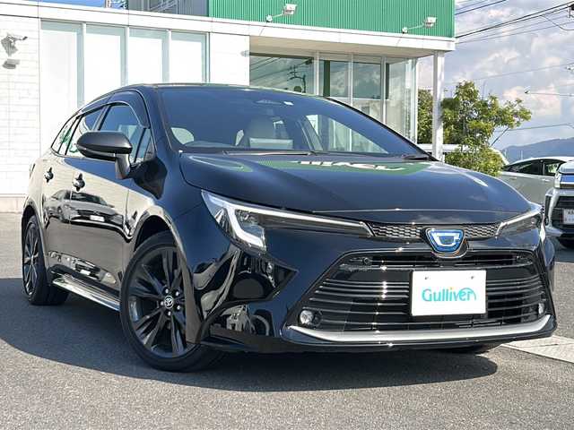 トヨタ カローラツーリング ハイブリッド ダブルバイビー 香川県 2023(令5)年 4.1万km アティチュードブラックマイカ 純正ナビ（フルセグTV/BT)/バックカメラ/ステアリングヒーター/ブラインドスポットモニター/ヘッドライトレベライザー/後退時交差車両検知警報システム/安心降車アシスト/ロードサインアシスト/シートヒーター/コーナーセンサー/オートライト/アイドリングストップ/ビルトインETC2.0
