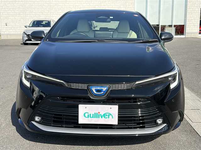 トヨタ カローラツーリング ハイブリッド ダブルバイビー 香川県 2023(令5)年 4.1万km アティチュードブラックマイカ 純正ナビ（フルセグTV/BT)/バックカメラ/ステアリングヒーター/ブラインドスポットモニター/ヘッドライトレベライザー/後退時交差車両検知警報システム/安心降車アシスト/ロードサインアシスト/シートヒーター/コーナーセンサー/オートライト/アイドリングストップ/ビルトインETC2.0