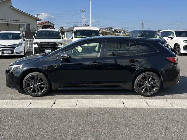 トヨタ カローラツーリング ハイブリッド ダブルバイビー 香川県 2023(令5)年 4.1万km アティチュードブラックマイカ 純正ナビ（フルセグTV/BT)/バックカメラ/ステアリングヒーター/ブラインドスポットモニター/ヘッドライトレベライザー/後退時交差車両検知警報システム/安心降車アシスト/ロードサインアシスト/シートヒーター/コーナーセンサー/オートライト/アイドリングストップ/ビルトインETC2.0