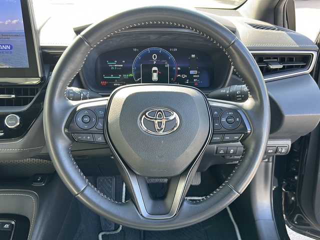 トヨタ カローラツーリング ハイブリッド ダブルバイビー 香川県 2023(令5)年 4.1万km アティチュードブラックマイカ 純正ナビ（フルセグTV/BT)/バックカメラ/ステアリングヒーター/ブラインドスポットモニター/ヘッドライトレベライザー/後退時交差車両検知警報システム/安心降車アシスト/ロードサインアシスト/シートヒーター/コーナーセンサー/オートライト/アイドリングストップ/ビルトインETC2.0