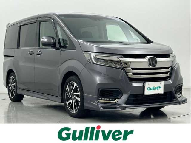 ホンダ ステップワゴン スパーダ クルスピセンシング 熊本県 2018(平30)年 6.6万km モダンスティールM 社外ナビPVIC-CL902（ＣＤ・ＤＶＤ・フルセグ・ＢＴ・ＳＤ・ＵＳＢ）/バックカメラ　/ビルトインＥＴＣ　/両側パワースライドドア　/クルーズコントロール　/前席シートヒーター　/衝突軽減ブレーキ　/レーンキープアシスト/先行車発進お知らせ機能/横滑り防止/アイドリングストップ/ハーフレザーシート/純正フロアマット/純正17インチAW/オートライト/LEDヘッドライト/スマートキー/プッシュスタート