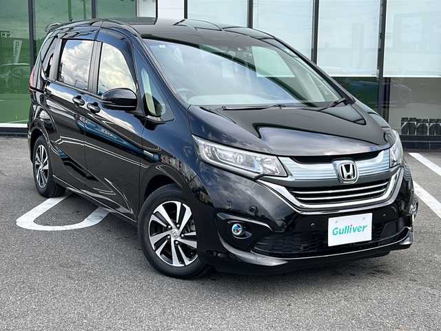 ホンダ フリード ハイブリット G ホンダセンシング 岐阜県 2019(令1)年 5.2万km プレミアムスパークルブラックパール 登録時走行距離：51132km/ワンオーナー/純正9インチナビ/バックカメラ/フルセグテレビ・CD・DVD・Bluetooth/両側パワースライドドア/ハーフレザーシート/ホンダセンシング/レーダークルーズコントロール/レーンキープアシスト/ビルトインETC/LEDヘッドライト/フォグランプ/オートライト/純正15インチアルミホイール/保証書/オーナーズマニュアル