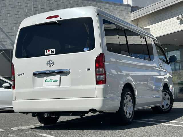 トヨタ ハイエース GL 奈良県 2013(平25)年 3.7万km ホワイトパールクリスタルシャイン インバーターDC電源/i seat ベッドキット/純正ディーラーナビ(VIE-X007W-8)/BT/CD/DVD//シンク付き/室内カーテン/社外後席モニター(ALPINE)/片側パワスラ/社外タイヤ(GEOLANDAR　X-AT)/バックカメラ/ETC/牽引フック/100V充電/オートLEDライト/三列シート/社外フロアマット(Vehicle)/取説・スペアキー付