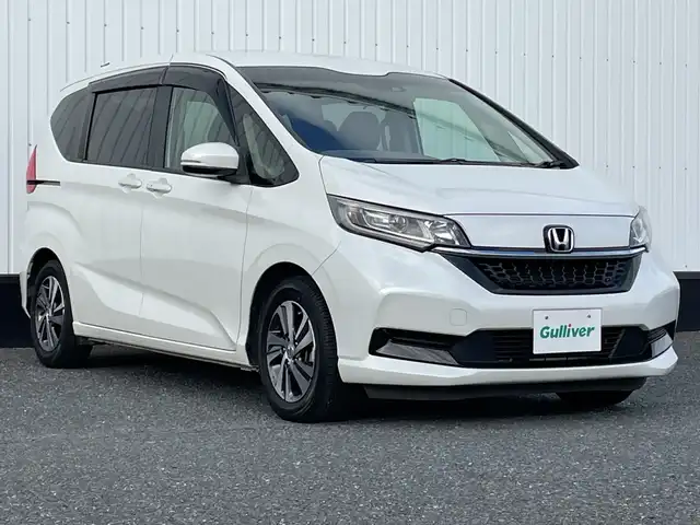 ホンダ フリード G ホンダセンシング 千葉県 2019(令1)年 3.7万km プラチナホワイトパール 純正SDナビ/(AM/FM/SD/DVD/BT/フルセグTV/AUX/iPod)/バックカメラ/前後ドライブレコーダー/衝突被害軽減システム/車線逸脱警報/クルーズコントロール/オートライト/ウィンカーミラー/電動格納ミラー/純正15インチAW/シートヒーター/シートリフター/プッシュスタート/スマートキー/フロアマット/ハーフレザーシート/両側パワースライドドア/横滑り防止装置/ETC/アイドリングストップ/LEDヘッドライト