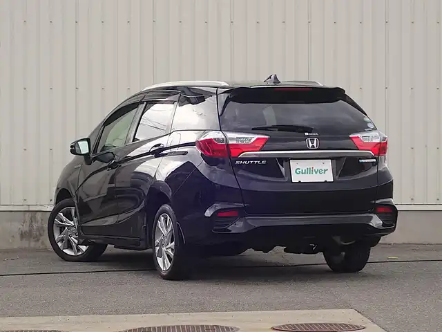 ホンダ シャトル ハイブリッド Z スタイルエディション 山形県 2016(平28)年 7.4万km クリスタルブラックパール 4WD/ワンオーナー/衝突被害軽減システム/純正SDナビ/　　【CD DVD BT フルセグ USB AUX】/バックカメラ/クルーズコントロール/LEDオートライト/ハーフレザー/シートヒーター/純正アルミ/ステアリングスイッチ/パドルシフト/電動格納ウィンカーミラー/フォグランプ/スマートキー/ＥＴＣ