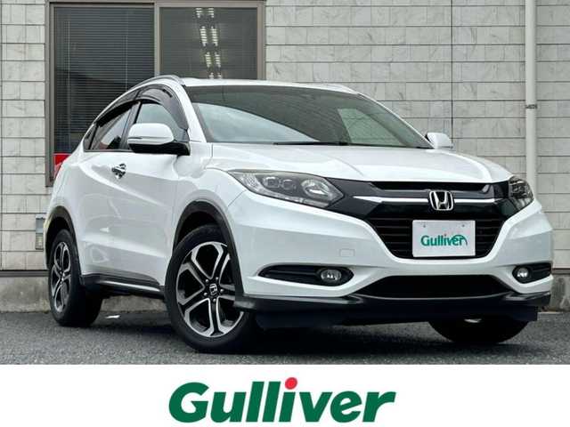 ホンダ ヴェゼル S 福岡県 2014(平26)年 9.8万km ホワイトオーキッドパール 純正メモリナビ【VXM-145VSi】/　(AM/FM/CD/DVD/Bluetooth/ワンセグTV)/バックカメラ/横滑り防止/クルーズコントロール/純正17インチアルミホイール/ルーフレール/電格ウィンカーミラー/ドアバイザー/黒色ハーフレザーシート/パドルシフト/ブレーキホールド/シートヒーター/アイドリングストップ/ETC/フロントガラス熱線スイッチ/保証書/ナビ取扱説明書