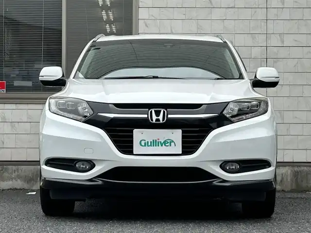 ホンダ ヴェゼル S 福岡県 2014(平26)年 9.8万km ホワイトオーキッドパール 純正メモリナビ【VXM-145VSi】/　(AM/FM/CD/DVD/Bluetooth/ワンセグTV)/バックカメラ/横滑り防止/クルーズコントロール/純正17インチアルミホイール/ルーフレール/電格ウィンカーミラー/ドアバイザー/黒色ハーフレザーシート/パドルシフト/ブレーキホールド/シートヒーター/アイドリングストップ/ETC/フロントガラス熱線スイッチ/保証書/ナビ取扱説明書
