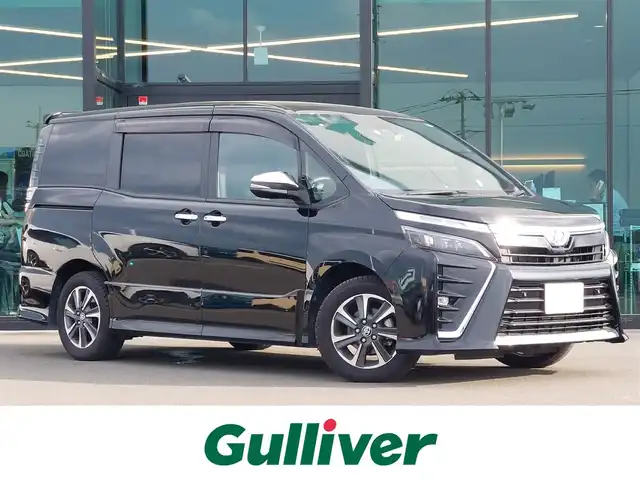 トヨタ ヴォクシー ZS 煌Ⅱ 東京都 2020(令2)年 2.9万km ブラック 純正10インチナビ/純正アルミホイール/ビルトインETC/Bluetooth/フルセグテレビ/プッシュスタート/ドライブレコーダー/トヨタセーフティセンス/バックカメラ/コーナーセンサー/純正フロアマット/ドアバイザー/キーレスエントリー/USB端子/新車保証書/取扱説明書