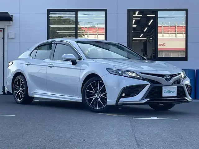 トヨタ カムリ WS 山口県 2022(令4)年 7.3万km プラチナホワイトパールマイカ ワンオーナー/純正ディスプレイオーディオ/・ナビキット/・Bluetooth接続/・CD/DVDキット/バックカメラ/ビルトインETC/ドライブレコーダー/Toyota Safety Sense/・プリクラッシュセーフティ/・レーントレーシングアシスト/・ロードサインアシスト/・レーダークルーズコントロール/・先行車発進告知機能/・ドライバー異常時対応システム/・ブラインドスポットモニター/・クリアランスソナー/・リヤクロストラフィックアラート/・パーキングサポートブレーキ/・オートマチックハイビーム/レザーシート/パワーバックドア/スマートキー/プッシュスタート/スペアキー1本/純正LEDライト/純正18インチアルミホイール/ドアバイザー/ウィンカーミラー/保証書