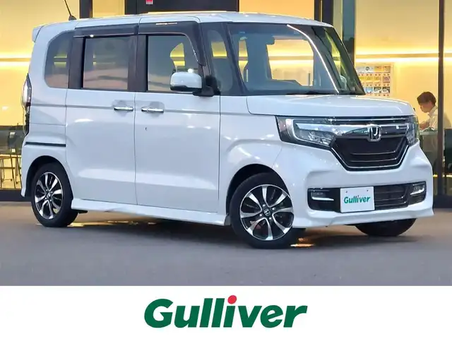 ホンダ Ｎ ＢＯＸ カスタム G L ホンダセンシング 東京都 2019(令1)年 2.2万km プラチナホワイトパール ホンダセンシング/・衝突軽減ブレーキ/・誤発進抑制機能/・後方誤発進抑制機能/・歩行者事故低減ステアリング/・路外逸脱抑制機能/・アダプティブ・クルーズ・コントロール/・車線維持支援システム/・オートハイビーム/・先行車発進お知らせ機能/・標識認識機能/プッシュスタート/純正ナビ　/・ＡＭ／ＦＭ／ＣＤ／ＤＶＤ/・フルセグＴＶ／Ｂｌｕｅｔｏｏｔｈ　/バックカメラ　/ＥＴＣ　/ドライブレコーダー/両側パワースライドドア　/後席ロールサンシェード/LEDヘッドライト/オートライト/ドアバイザー/14インチ純正アルミホイール/スマートキー