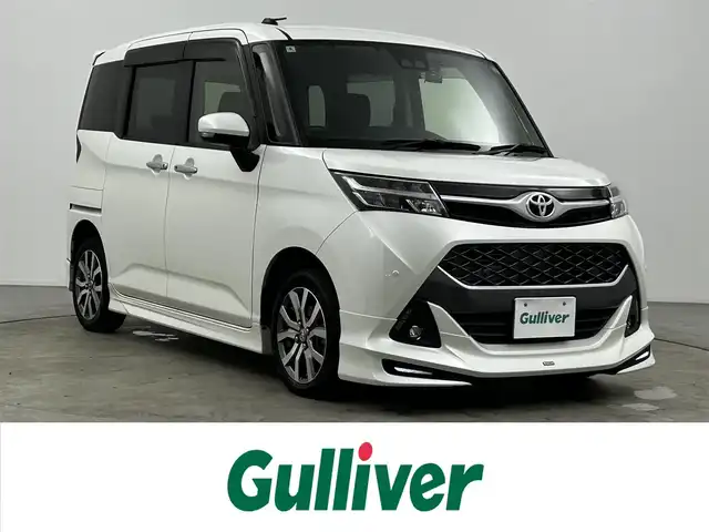 トヨタ タンク カスタムG－T 大分県 2020(令2)年 2.1万km パールホワイトⅢ 純正SDナビ（NSZT-W68T）/ BT/フルセグ/CD/DVD/モデリスタエアロ/スマートアシスト/・衝突警報機能/・衝突回避支援ブレーキ機能/・誤発進抑制制御機能/・車線逸脱警報機能/・先行車発進お知らせ機能/・オートハイビーム/両側パワースライドドア/バックカメラ/アイドリングストップ/ビルトインETC/LEDヘッドライト/ドライブレコーダー（前後）/純正アルミホイル15インチ/純正フロアマット/革巻ステアリング/革巻シフトノブ