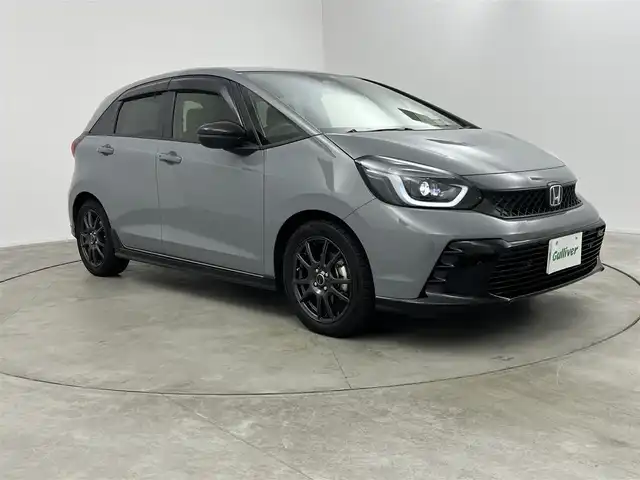 ホンダ フィット e:HEV RS 愛知県 2023(令5)年 1.8万km グレー 純正DA（ワンセグ、CS、Bluetooth）/ETC/Bカメラ/ACC/電子パーキング/オートホールド/衝突軽減ブレーキ/レーンキープアシスト/コーナーセンサー/スマートキー/ハーフレザーシート/USB/スマートキー/純正フロアマット/純正16インチAW/オートライト/三点エアバック/横滑り防止装置