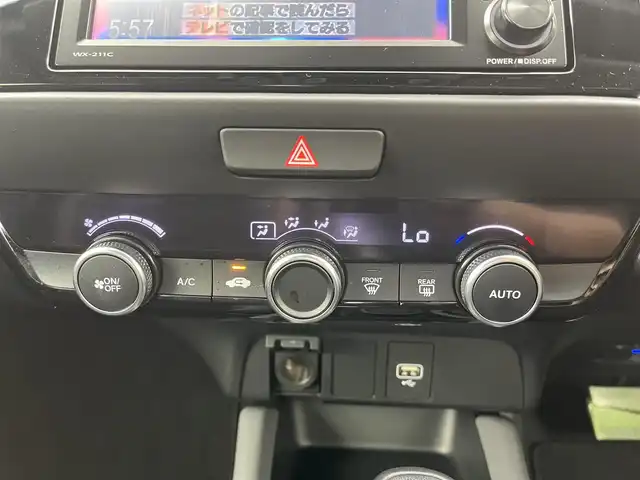 ホンダ フィット e:HEV RS 愛知県 2023(令5)年 1.8万km グレー 純正DA（ワンセグ、CS、Bluetooth）/ETC/Bカメラ/ACC/電子パーキング/オートホールド/衝突軽減ブレーキ/レーンキープアシスト/コーナーセンサー/スマートキー/ハーフレザーシート/USB/スマートキー/純正フロアマット/純正16インチAW/オートライト/三点エアバック/横滑り防止装置