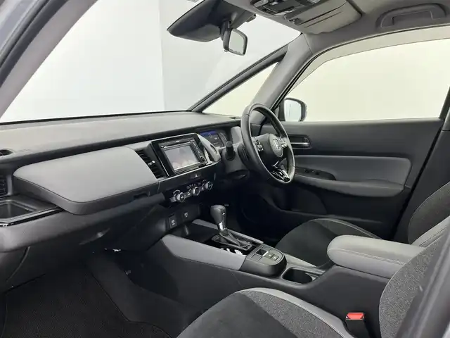 ホンダ フィット e:HEV RS 愛知県 2023(令5)年 1.8万km グレー 純正DA（ワンセグ、CS、Bluetooth）/ETC/Bカメラ/ACC/電子パーキング/オートホールド/衝突軽減ブレーキ/レーンキープアシスト/コーナーセンサー/スマートキー/ハーフレザーシート/USB/スマートキー/純正フロアマット/純正16インチAW/オートライト/三点エアバック/横滑り防止装置