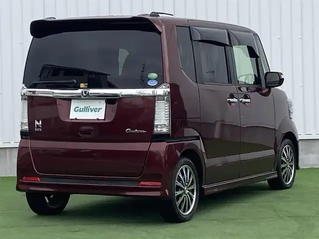 ホンダ Ｎ ＢＯＸ カスタム G ターボSSパッケージ 香川県 2014(平26)年 6.7万km プレミアムディープロッソパール 社外メモリーナビ/→AM/FM/CD/DVD/Bluetooth/フルセグTV/バックカメラ/両側パワースライドドア/シートヒーター/クルーズコントロール/GPSレーダー/前後ドライブレコーダー/革巻きステアリング/アイドリングストップ/HIDヘッドライト/ETC/プッシュスタート/スマートキー/CTBA/オートライト