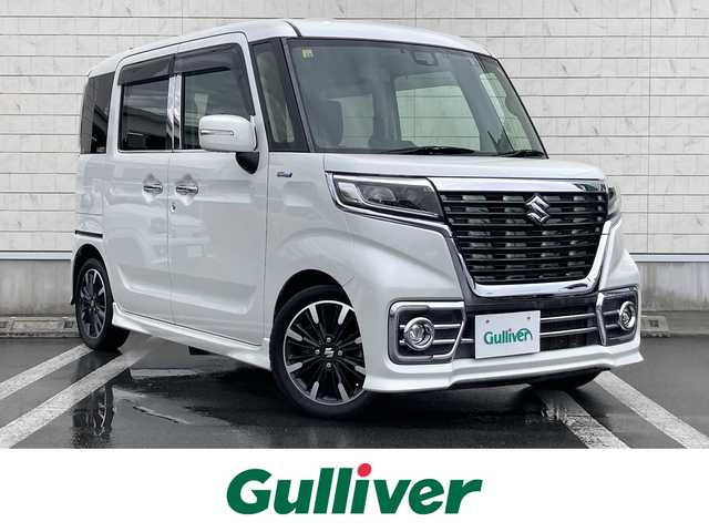 スズキ スペーシア カスタム HYBRID XS ターボ 静岡県 2018(平30)年 8.9万km ピュアホワイトP デュアルセンサーブレーキサポート/純正メモリーナビ(CN-RZ765W)/　AM FM CD DVD Bluetooth USB SD/ビルトインETC/前後方ドライブレコーダー/LEDオートヘッドランプ/レーダークルーズコントロール/シートヒーター(運転席)/両側パワースライドドア/リアクリアランスソナー/レザー調シートカバー/純正15インチアルミホイール/リアロールサンシェード/パドルシフト/フルセグTV/バックモニター