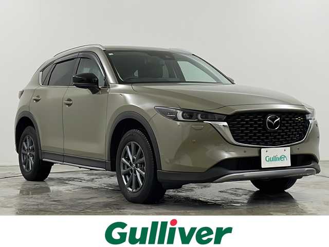マツダ ＣＸ－５ XD フィールドジャーニー 岐阜県 2022(令4)年 1.4万km ジルコンサンドメタリック ・４WD/・ETC2.0/・ドライブレコーダー/・純正ナビ/（Bluetooth/USB/フルセグテレビ）/・全周囲カメラ/・ヘッドアップディスプレイ/・アダプティブクルーズコントロール/・パワーバックドア/・コーナーセンサー/・レーントレーシングアシスト/・シートヒーター（１，２列）/・ブラインドスポットモニター/・純正17インチアルミホイール/・純正LEDヘッドライト/・フォグランプ/・デジタルインナーミラー/・ステアリングヒーター/・パドルシフト/・オートマチックハイビーム